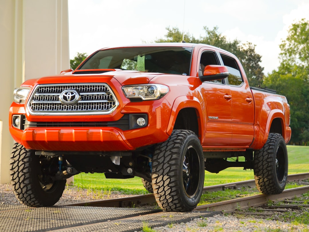 Lifted off-road truck with suspension components visible, suitable for trail overlanding